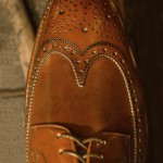Il primo passo sulle orme dell'eleganza -derby full brogue du Doriano Marcucci, caratterizzata dalla scelta delle impunture