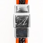 Skin nero arancio - dettaglio chiusura
