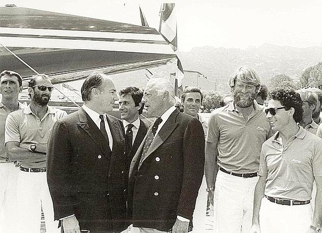 Gianni Agnelli - and - Laga - Khan at the launch of Azur the first ever Italian Challenger for the America's Cup . We are in 1983. Right bearded helmsman Mauro Pelaschier .